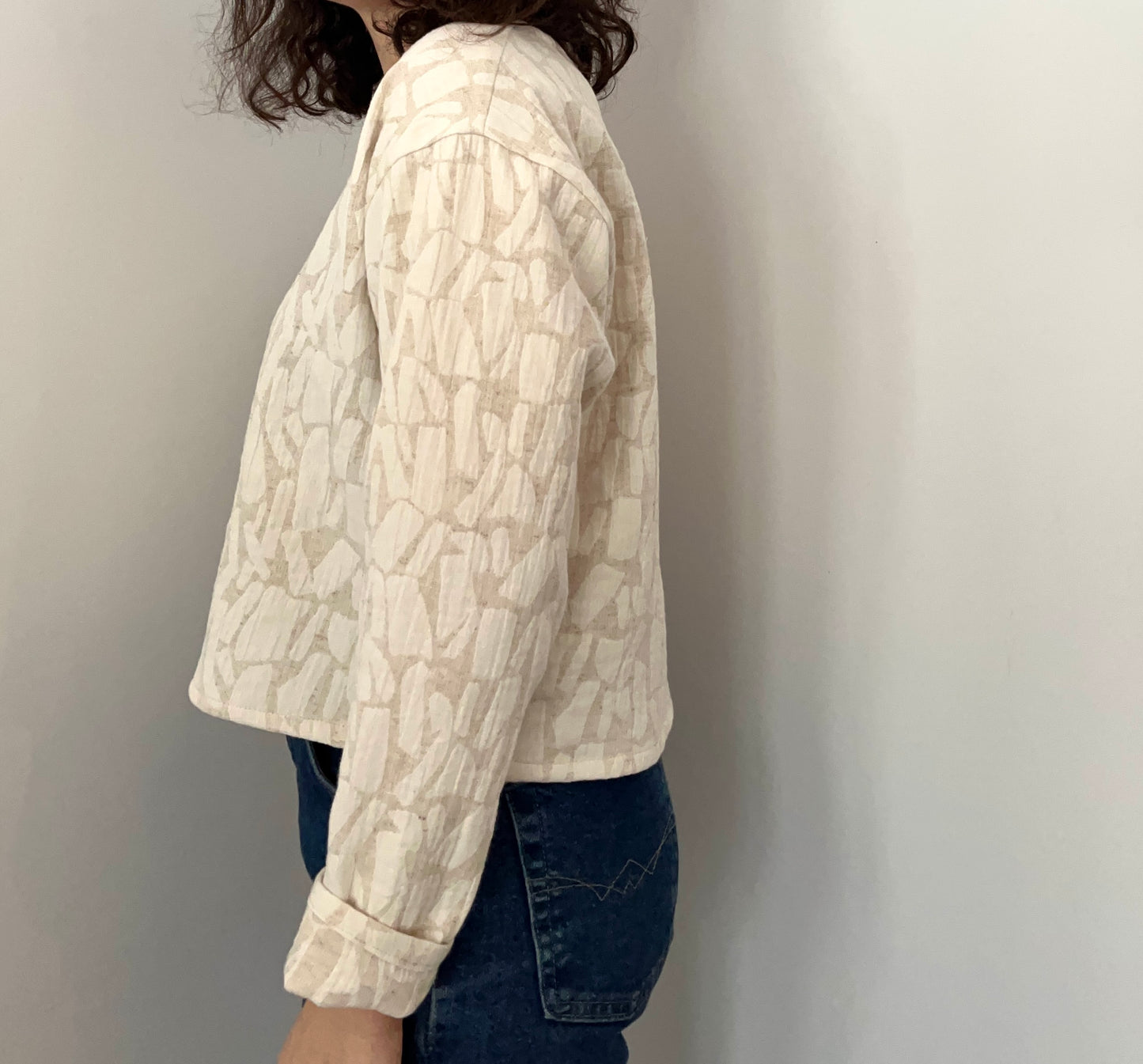 Cream textured long sleeve top